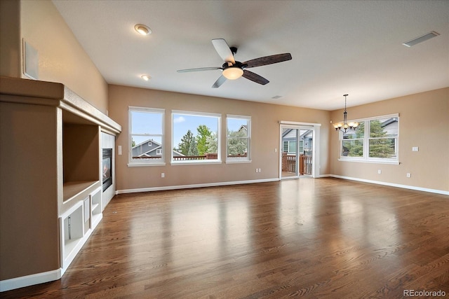 22873 E David Pl, Aurora, CO 80016 - unfurnished living room featuring a chandelier, ceiling fan, and dark wood finished floors
