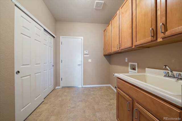 22873 E David Pl, Aurora, CO 80016 - laundry room with hookup for a washing machine, cabinet space, and a textured ceiling