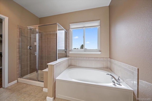 22873 E David Pl, Aurora, CO 80016 - bathroom with a garden tub, a stall shower, tile patterned flooring, and a walk in closet