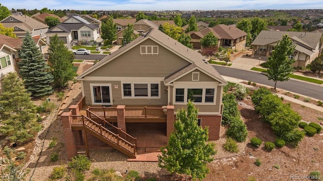 22873 E David Pl, Aurora, CO 80016 - back of house featuring a residential view, a wooden deck, and stairway