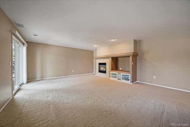 22873 E David Pl, Aurora, CO 80016 - unfurnished living room featuring carpet flooring and a tile fireplace