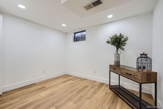 basement featuring hardwood / wood-style flooring