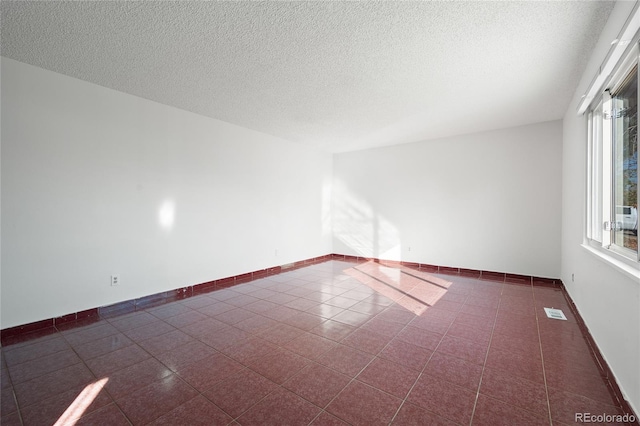 empty room with a textured ceiling