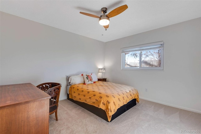 bedroom with baseboards, ceiling fan, and light colored carpet