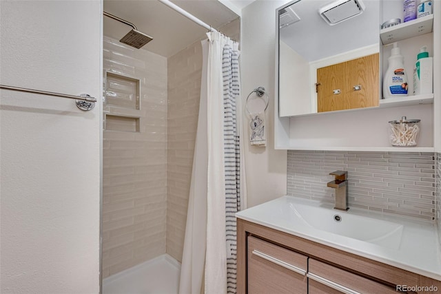 full bathroom with a shower stall, vanity, and decorative backsplash