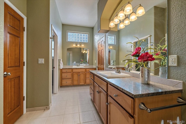 bathroom with vanity and tile patterned floors