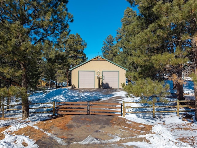 view of snow covered garage