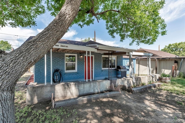 3151 N Elizabeth St, Denver, CO 80205 - view of front of home featuring covered porch and brick siding