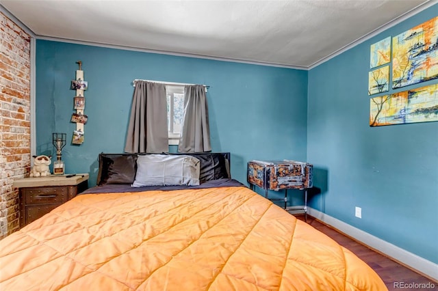 3151 N Elizabeth St, Denver, CO 80205 - bedroom with wood finished floors and brick wall