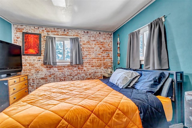 3151 N Elizabeth St, Denver, CO 80205 - bedroom featuring brick wall and crown molding