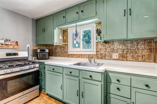 3151 N Elizabeth St, Denver, CO 80205 - kitchen featuring stainless steel range with gas cooktop, green cabinets, and light countertops