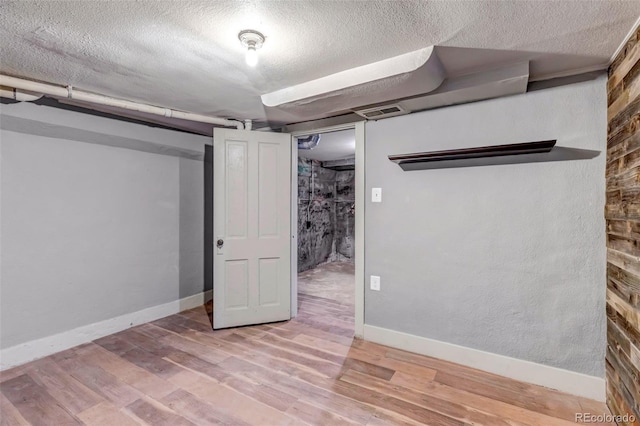 3151 N Elizabeth St, Denver, CO 80205 - finished below grade area with a textured ceiling and wood finished floors
