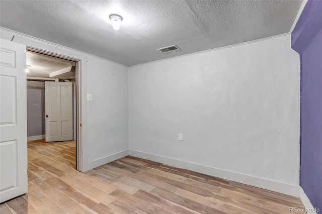 3151 N Elizabeth St, Denver, CO 80205 - empty room with light wood-style flooring and a textured ceiling