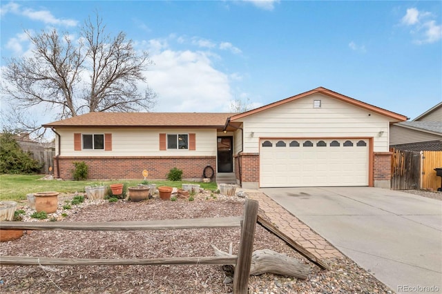 ranch-style house with brick siding, an attached garage, concrete driveway, and fence