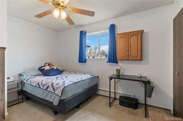 bedroom with light colored carpet, a baseboard radiator, a ceiling fan, and a textured ceiling
