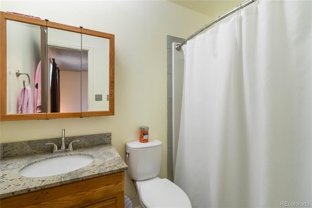 full bath with toilet and vanity