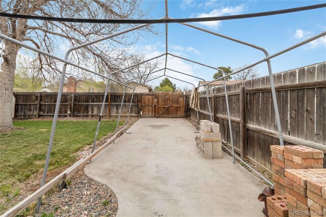 view of patio with a gate