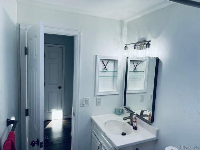 bathroom with vanity and hardwood / wood-style flooring