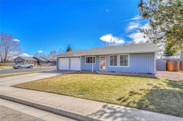 ranch-style house with concrete driveway, a front lawn, an attached garage, and fence