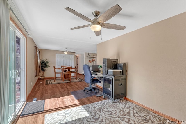 1786 Wintergreen Pl, Loveland, CO 80537 - office area featuring baseboards and wood finished floors