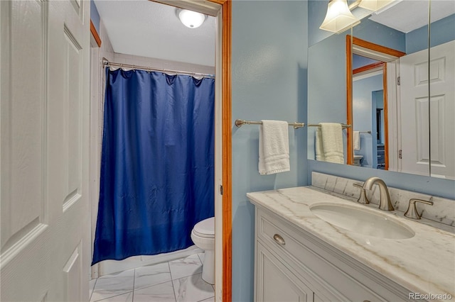 1786 Wintergreen Pl, Loveland, CO 80537 - full bathroom featuring marble finish floor, a shower with shower curtain, vanity, and toilet