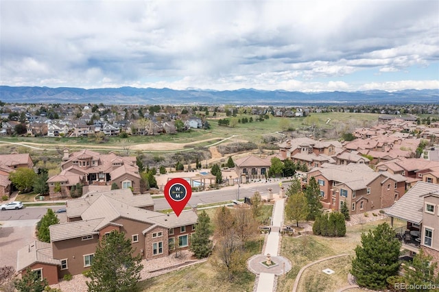 aerial perspective of suburban area featuring a mountain backdrop