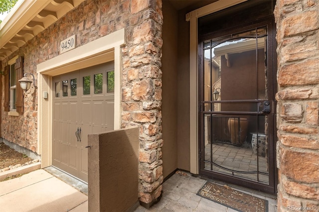 entrance to property featuring stone siding