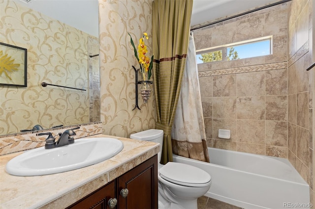 full bath with toilet, vanity, shower / bath combo, and wallpapered walls