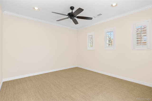 unfurnished room featuring light colored carpet, recessed lighting, baseboards, ceiling fan, and crown molding