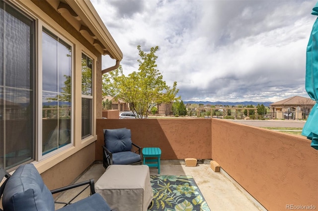 balcony featuring a mountain view