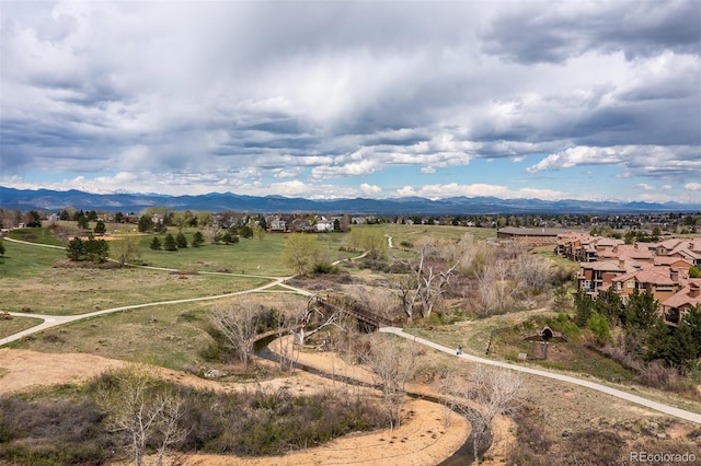 aerial view of sparsely populated area with mountains