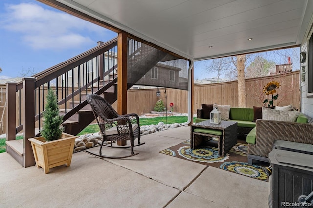 9249 Fox Fire Dr, Highlands Ranch, CO 80129 - fenced backyard with a patio, outdoor lounge area, and stairway