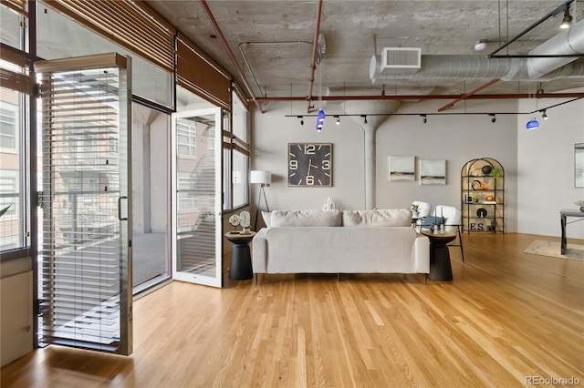 unfurnished living room with light hardwood / wood-style floors