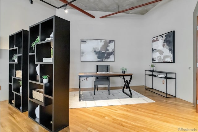 office space with hardwood / wood-style floors