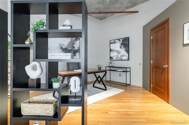 home office with hardwood / wood-style flooring