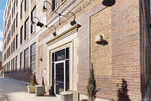 exterior space featuring brick siding