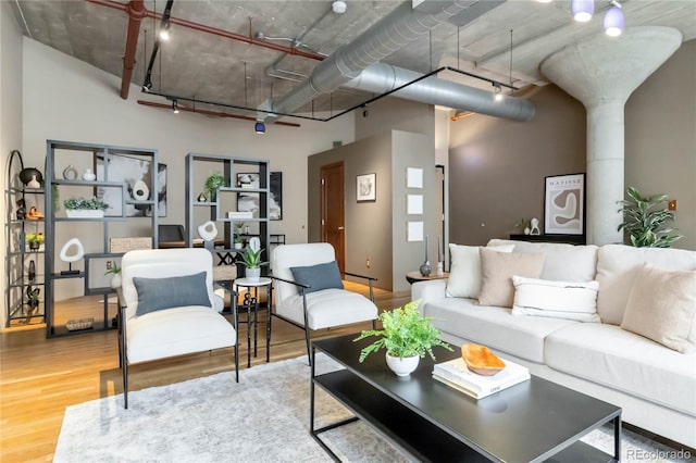 1863 Wazee St Unit 6E, Denver, CO 80202 - living room featuring wood finished floors and rail lighting