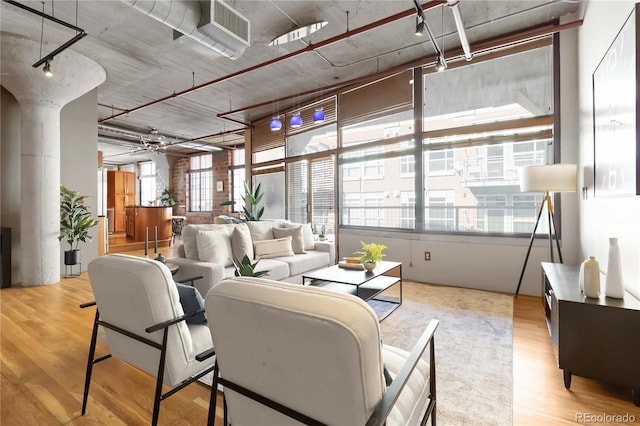 1863 Wazee St Unit 6E, Denver, CO 80202 - living room with wood finished floors and ornate columns