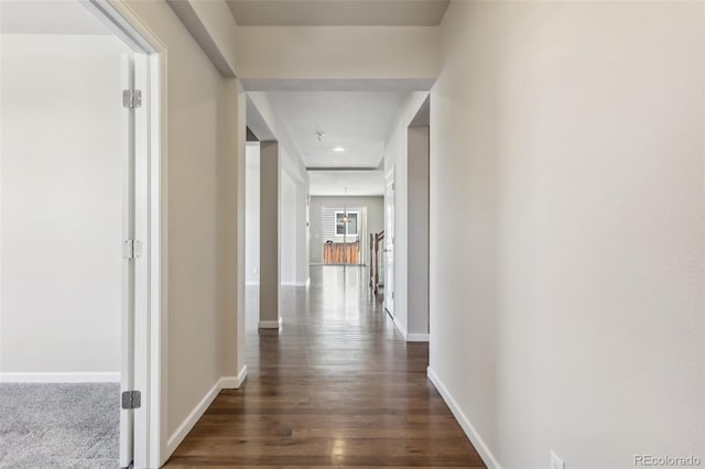 3823 Horiuchi St, Brighton, CO 80601 - hall featuring baseboards and dark wood-type flooring