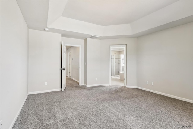 3823 Horiuchi St, Brighton, CO 80601 - unfurnished bedroom with a raised ceiling, carpet, baseboards, and ensuite bath