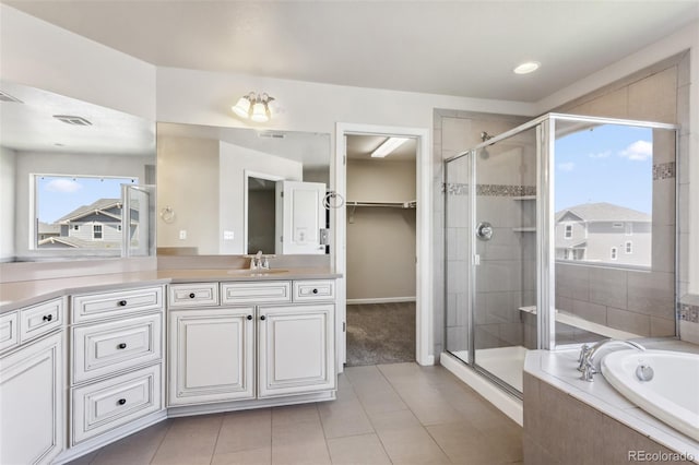 3823 Horiuchi St, Brighton, CO 80601 - bathroom with vanity, a stall shower, a garden tub, and plenty of natural light