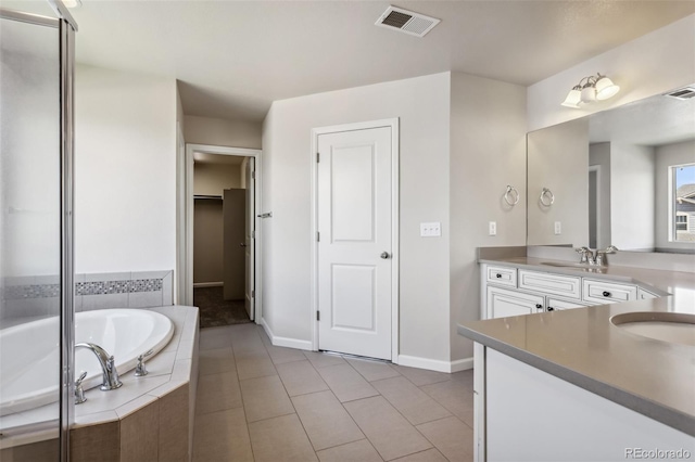 3823 Horiuchi St, Brighton, CO 80601 - full bathroom with vanity, a bath, baseboards, tile patterned flooring, and a shower stall