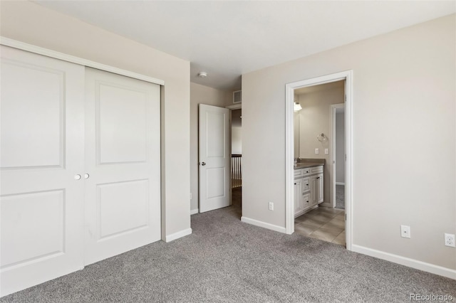 3823 Horiuchi St, Brighton, CO 80601 - unfurnished bedroom featuring carpet floors, a closet, baseboards, and ensuite bath