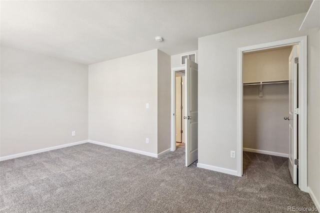 3823 Horiuchi St, Brighton, CO 80601 - unfurnished bedroom with carpet floors, a spacious closet, baseboards, and a closet