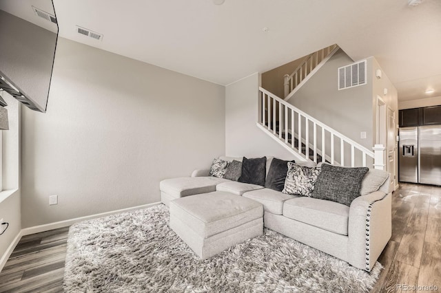 23545 E Platte Dr Unit C, Aurora, CO 80016 - living room with wood finished floors, stairs, and baseboards