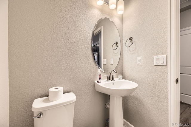 23545 E Platte Dr Unit C, Aurora, CO 80016 - bathroom featuring a textured wall and toilet