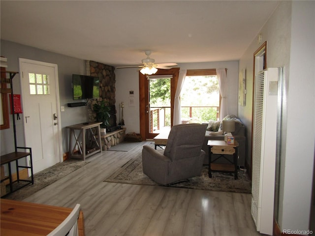 57920 US Highway 285 Unit 10, Bailey, CO 80421 - living area with a heating unit, wood finished floors, and ceiling fan
