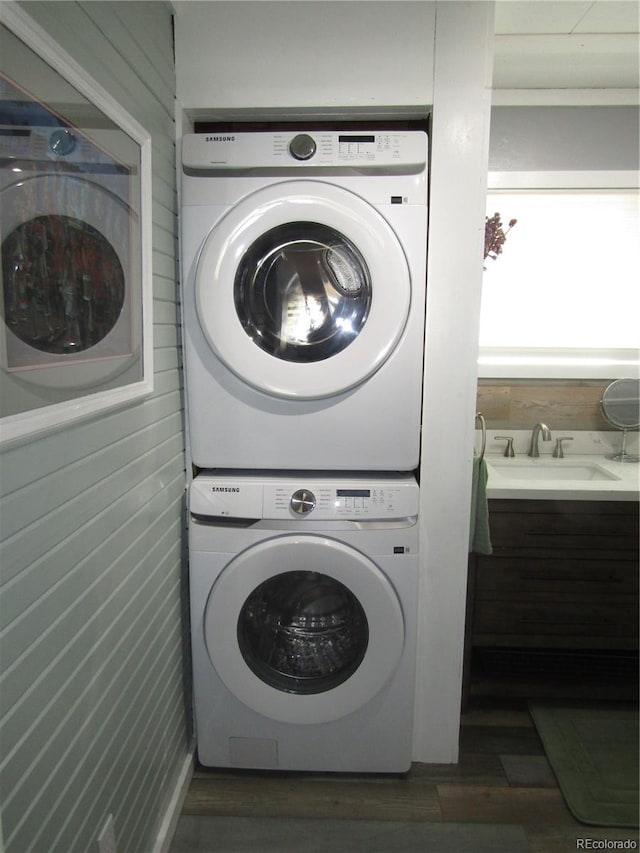 57920 US Highway 285 Unit 10, Bailey, CO 80421 - laundry room with stacked washer / dryer and wood finished floors