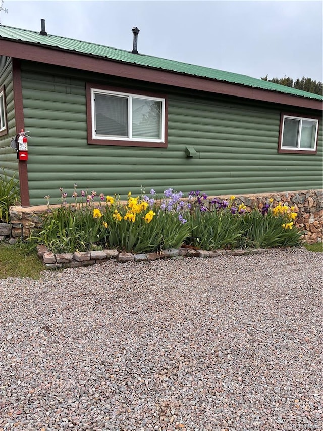 57920 US Highway 285 Unit 10, Bailey, CO 80421 - view of property exterior with a metal roof and faux log siding