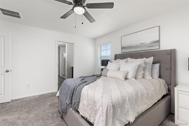 carpeted bedroom featuring baseboards, visible vents, and a ceiling fan